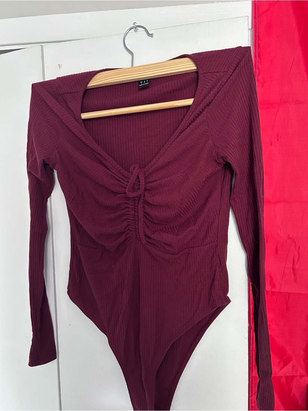 burgundy body suit